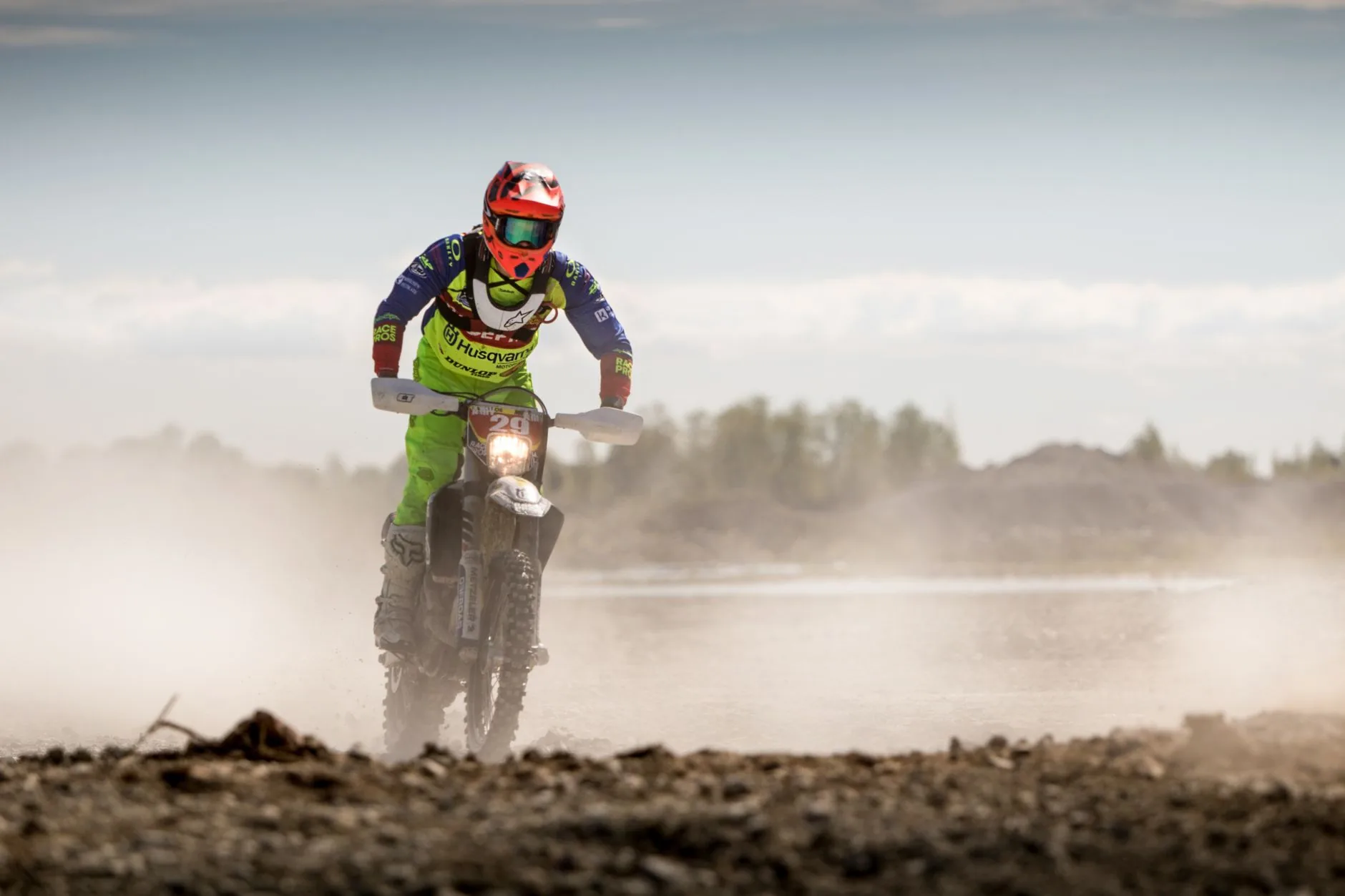 Woman riding motorcycle on winding mountain road, Europe motorcycle tours adventure routes.
