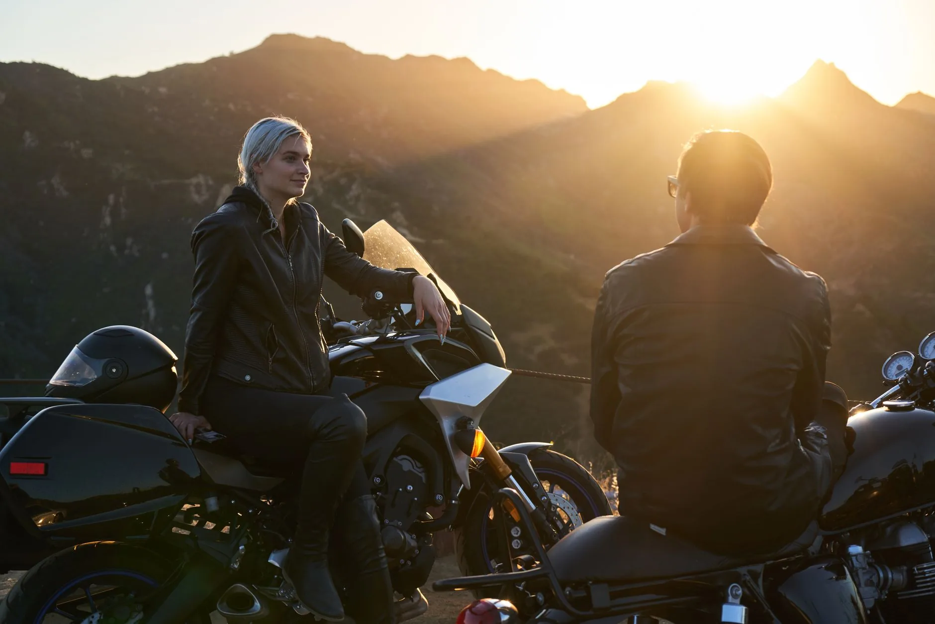 Adventure rider on Honda XRE 300, exploring rugged terrain under soft, diffused light.